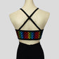 back view of the metallic rainbow zigzag crop top with black straps