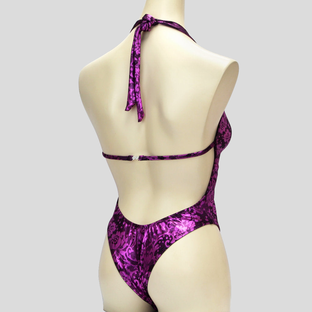 back of womens' bodybuilding one piece in a purple floral lace print