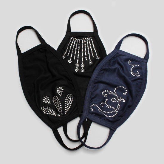 Bundle of Australian made bamboo fabric face masks that are decorated with diamante crystals in varying designs