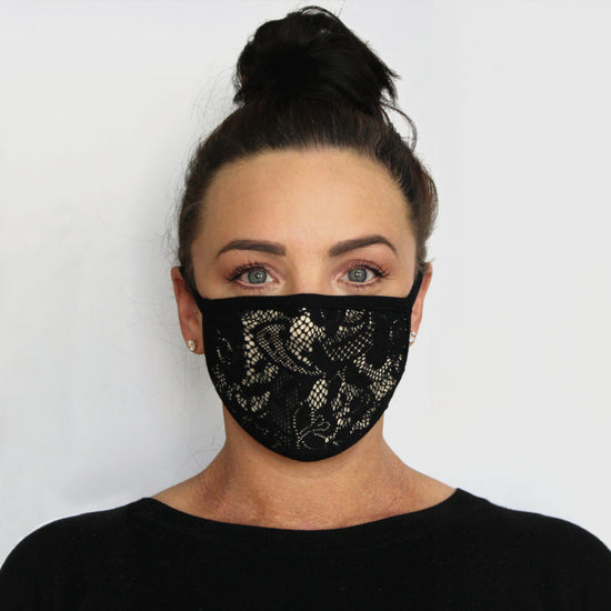 Woman wearing an Australian made face mask with black lace overlaying nude fabric