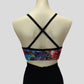 back view of the colourful foiled multiprint crop top with black cross straps