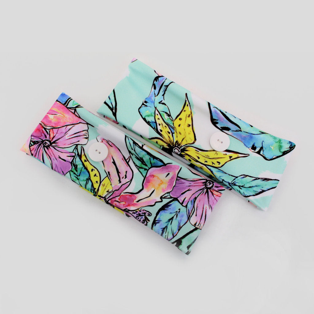 Ear saver button headband in a colourful watercolour style floral print