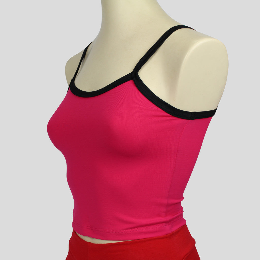 side view of the basic pink midriff crop singlet with contrasting black straps