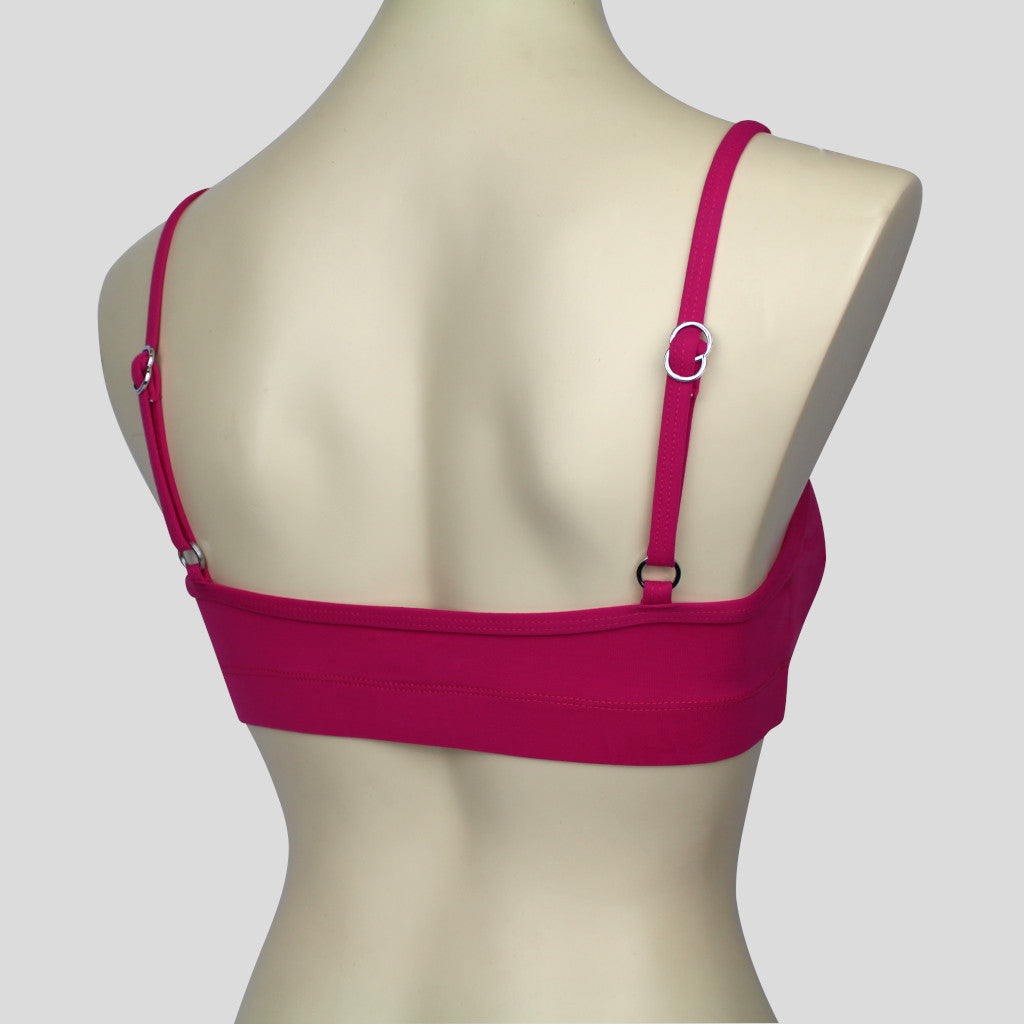 back view of light to medium support active crop top with adjustable thin straps