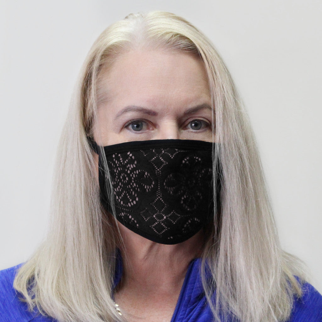 Woman wearing Australian made Bamboo Fabric face mask in a pale pink nude shade with black bind and black lace