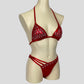 side view of bodybuilding bikini in red with triangle diamante displays and strappy bottoms
