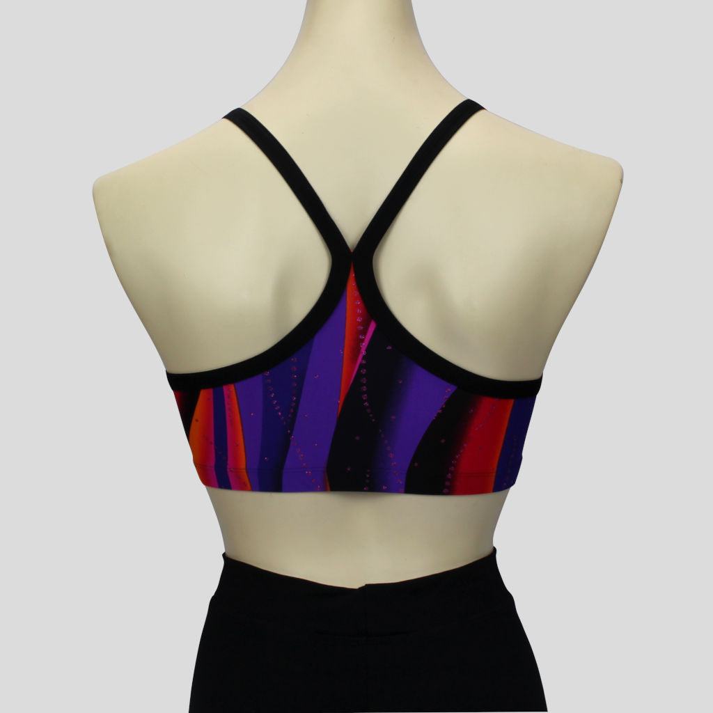 back view of the girls' sunset swirl print crop top with pink glitter trails and black straps