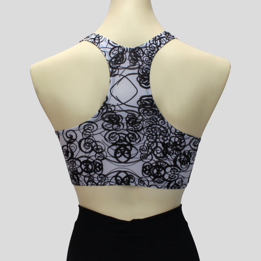 back view of the white and black curls pattern crop top in a sportsback style