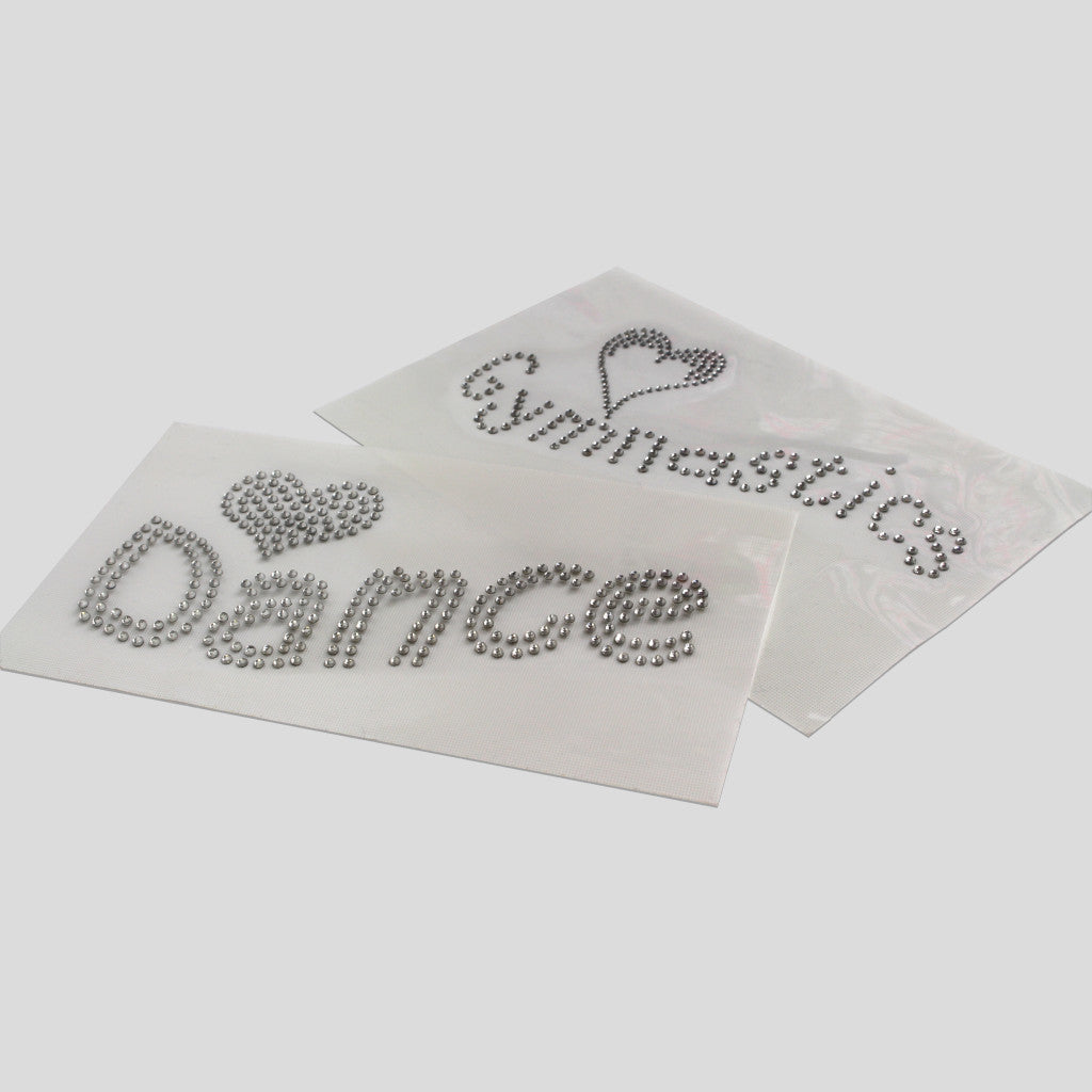 two diamante crystal iron on transfers with one saying dance and the other saying gymnastics
